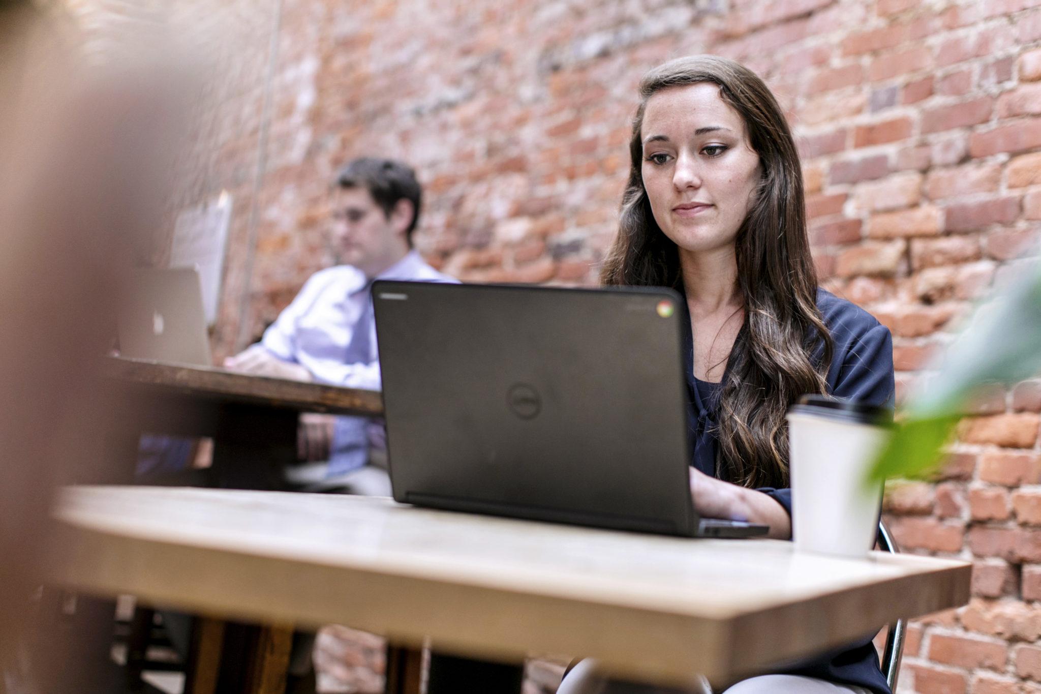 Coker student studying at a table in a restaurant (decorative)